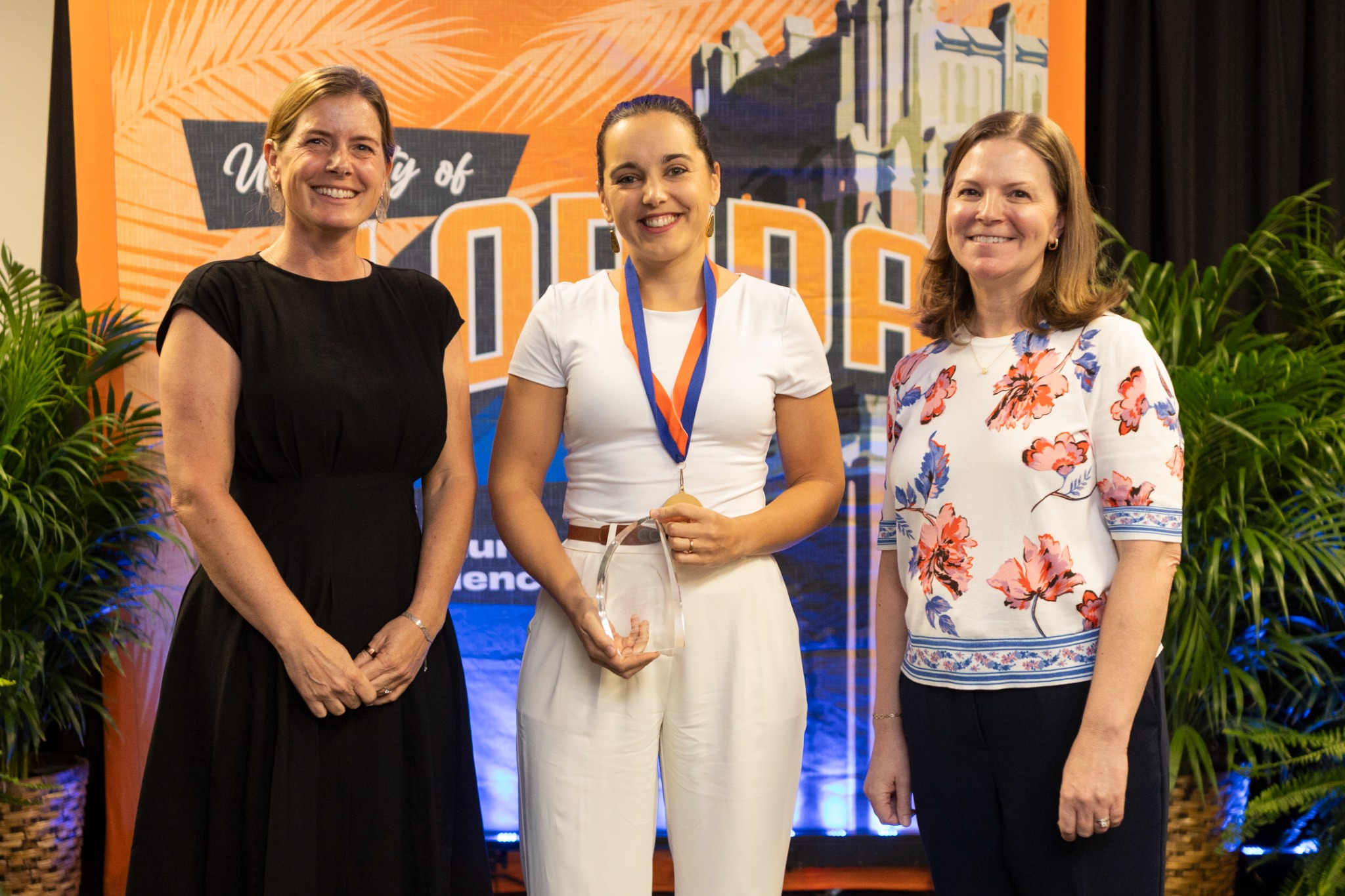 Vanesa at the 2026 CALS awards ceremony holding her teaching award